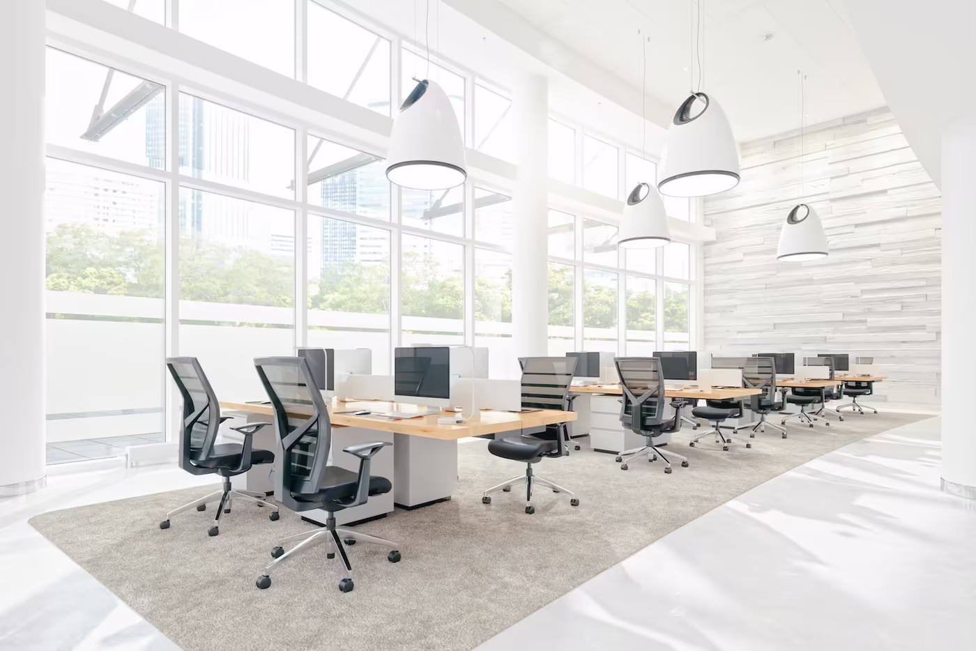Bright open-plan office illustrating typical space allocation per employee