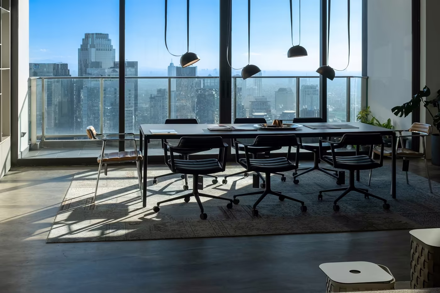 Modern meeting room with panoramic city view used for workspace planning
