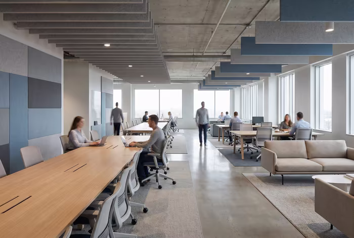 Modern coworking space with wooden meeting pod, exposed brick walls, and stylish lounge seating