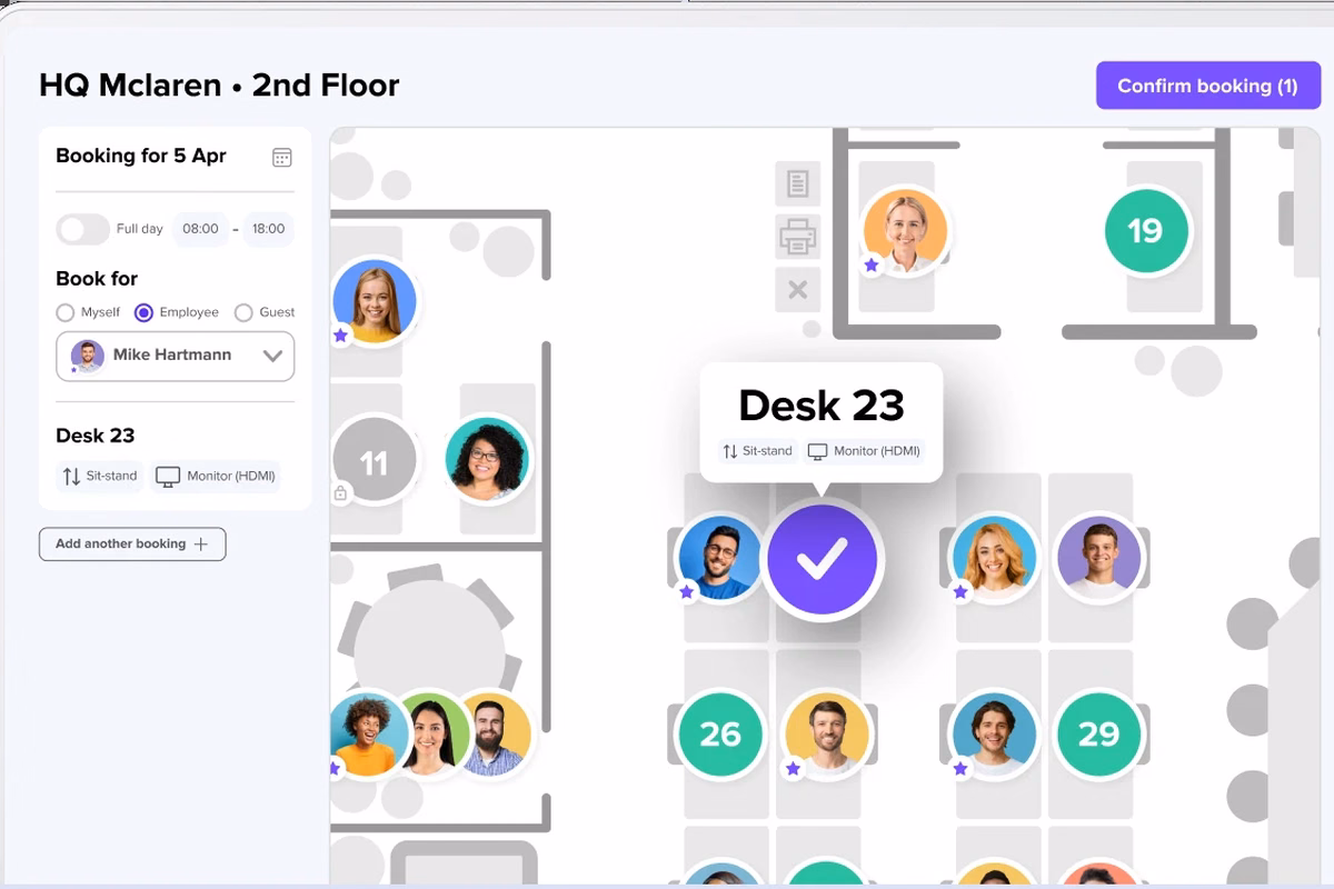 Desk booking interface deskbird showing an interactive office floor plan with available desks, employee profiles, and booking options.