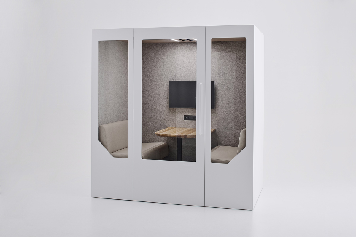 White Persy Four acoustic meeting booth with spacious seating, a wooden table, wall-mounted monitor, and grey acoustic interior.