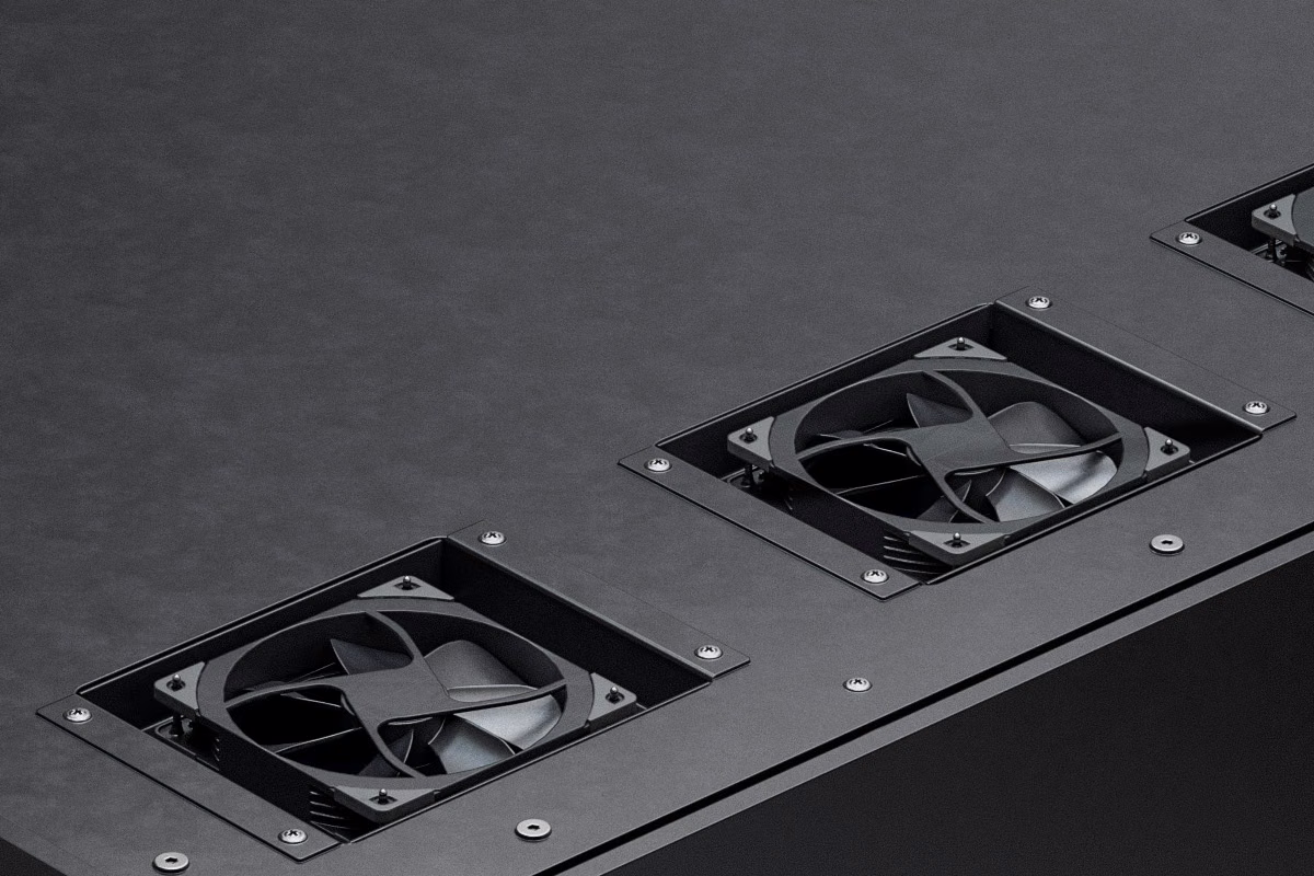 Close-up of the top of a Persy acoustic booth showing the integrated ventilation fans mounted in the roof panel.