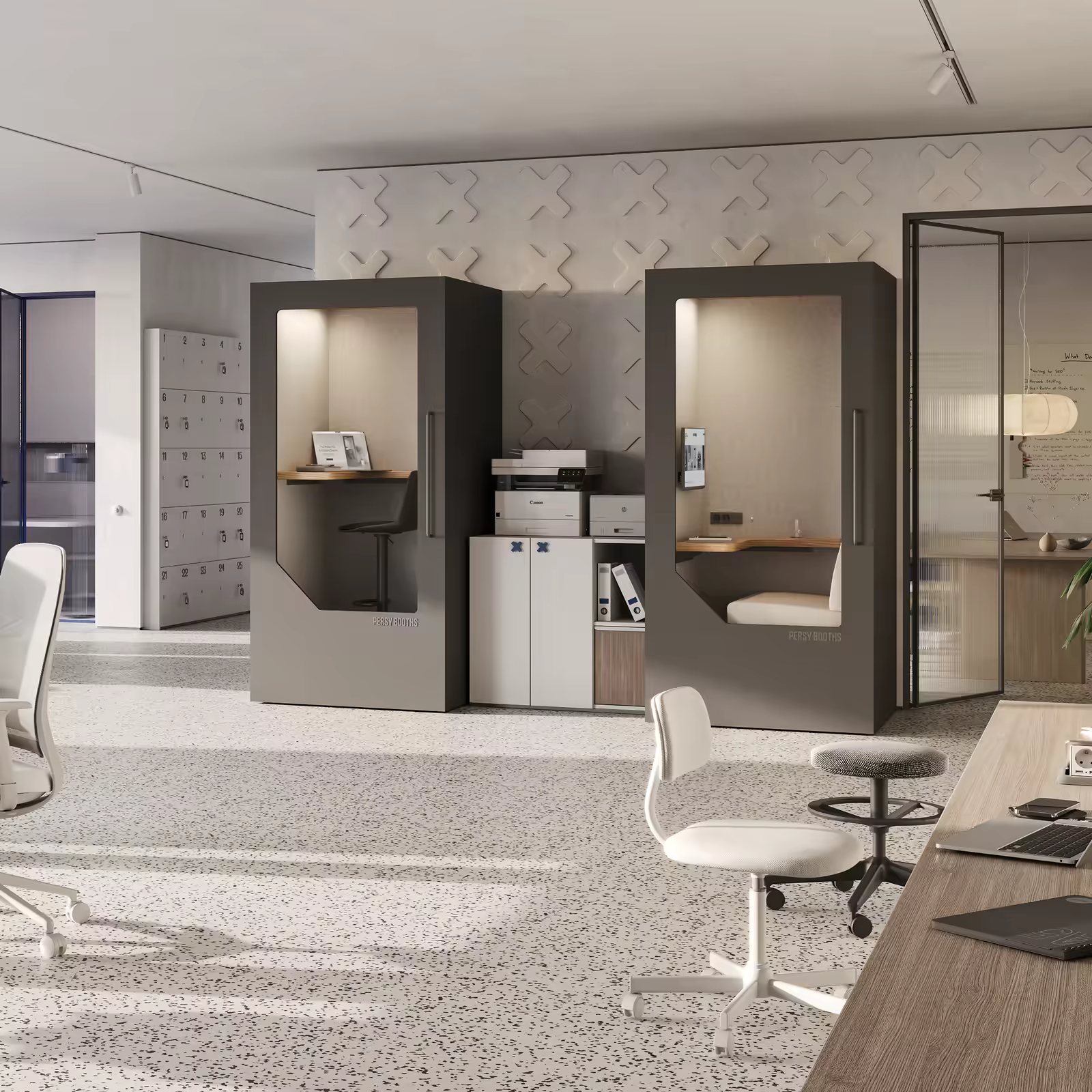 Two Persy Booths office pods with lit interiors in a bright open-plan office.