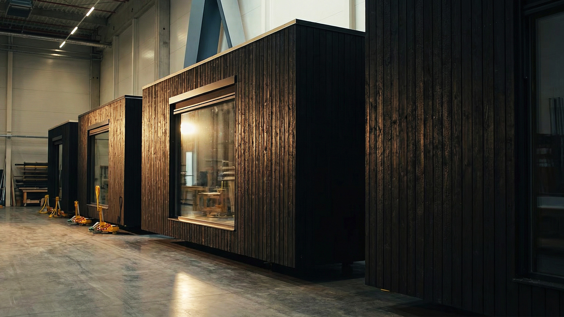 BIOBUILDS factory floor showing modular home assembly