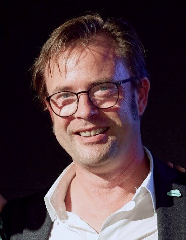 Klaas smiling friendly into the camera