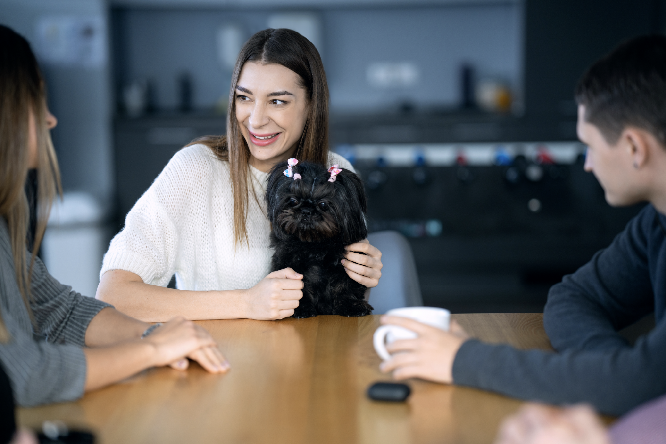 Quadigi employee with a dog in her lap