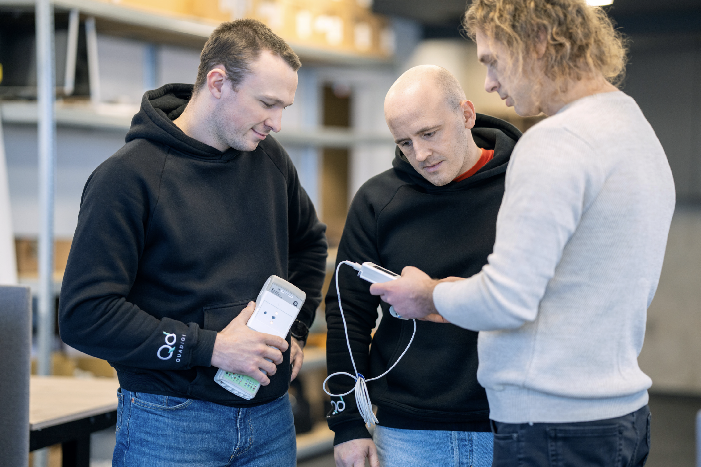 Quadigi team members discussing medical devices