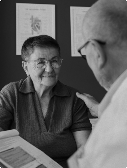 Clinician talking with an older patient