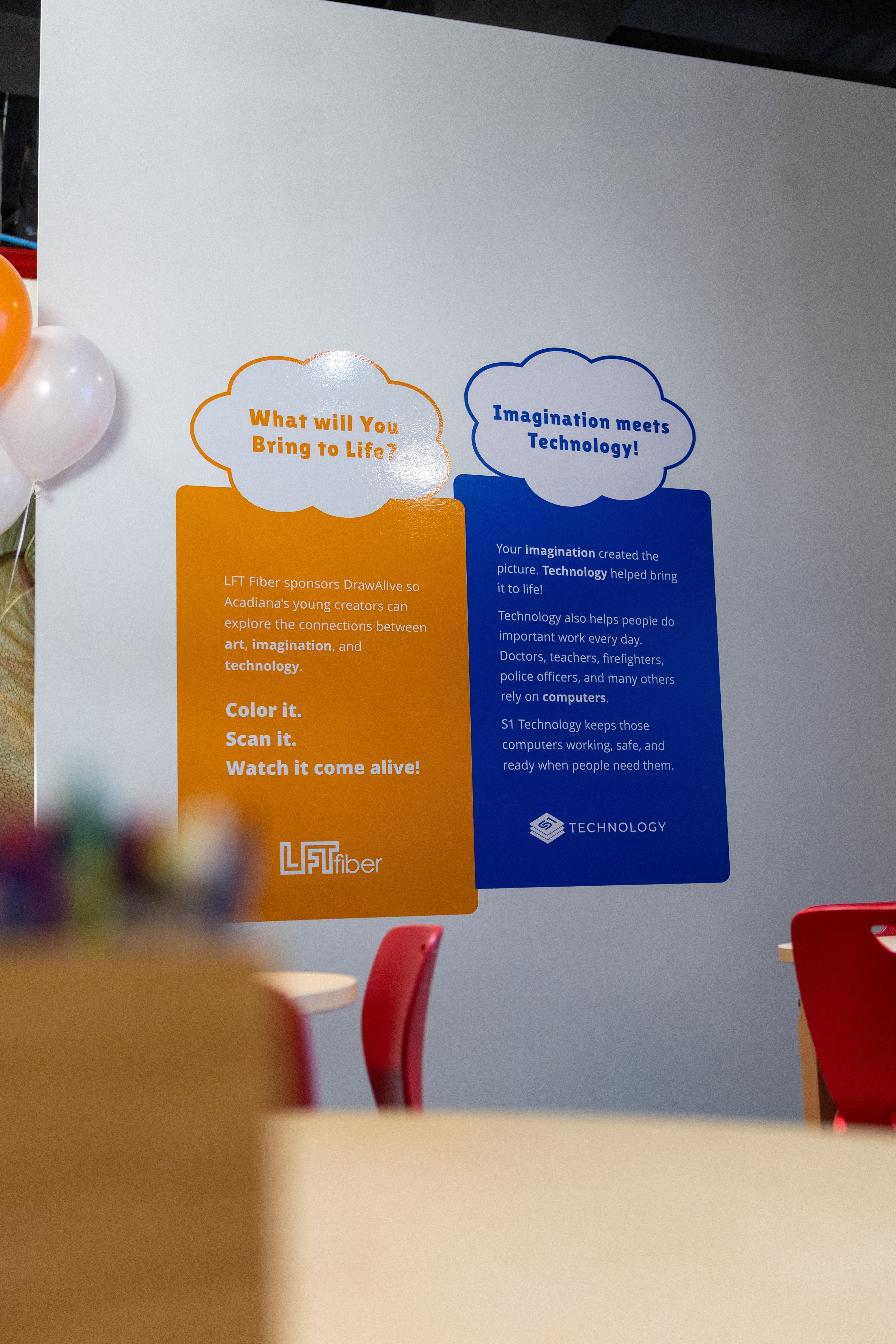 Draw Alive exhibit signage recognizing LFT Fiber and S1 Technology at the Children's Museum of Acadiana.