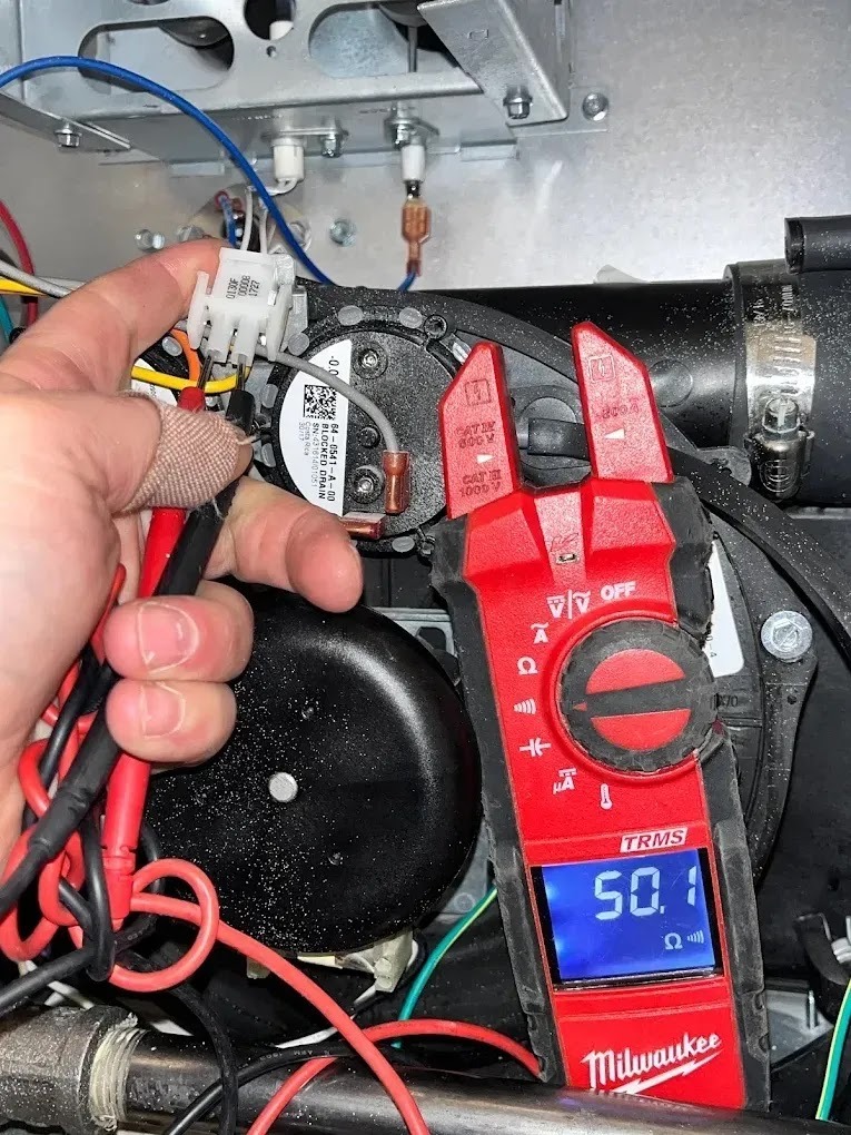 Technician performing preventative maintenance on an air conditioning unit