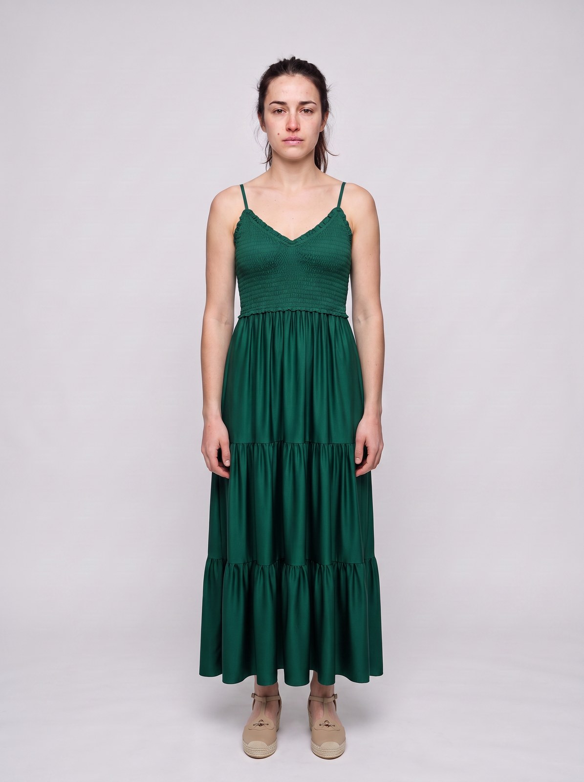 E-commerce photo of the same AI model wearing an emerald green maxi dress, generated in Photo Studio with character card references