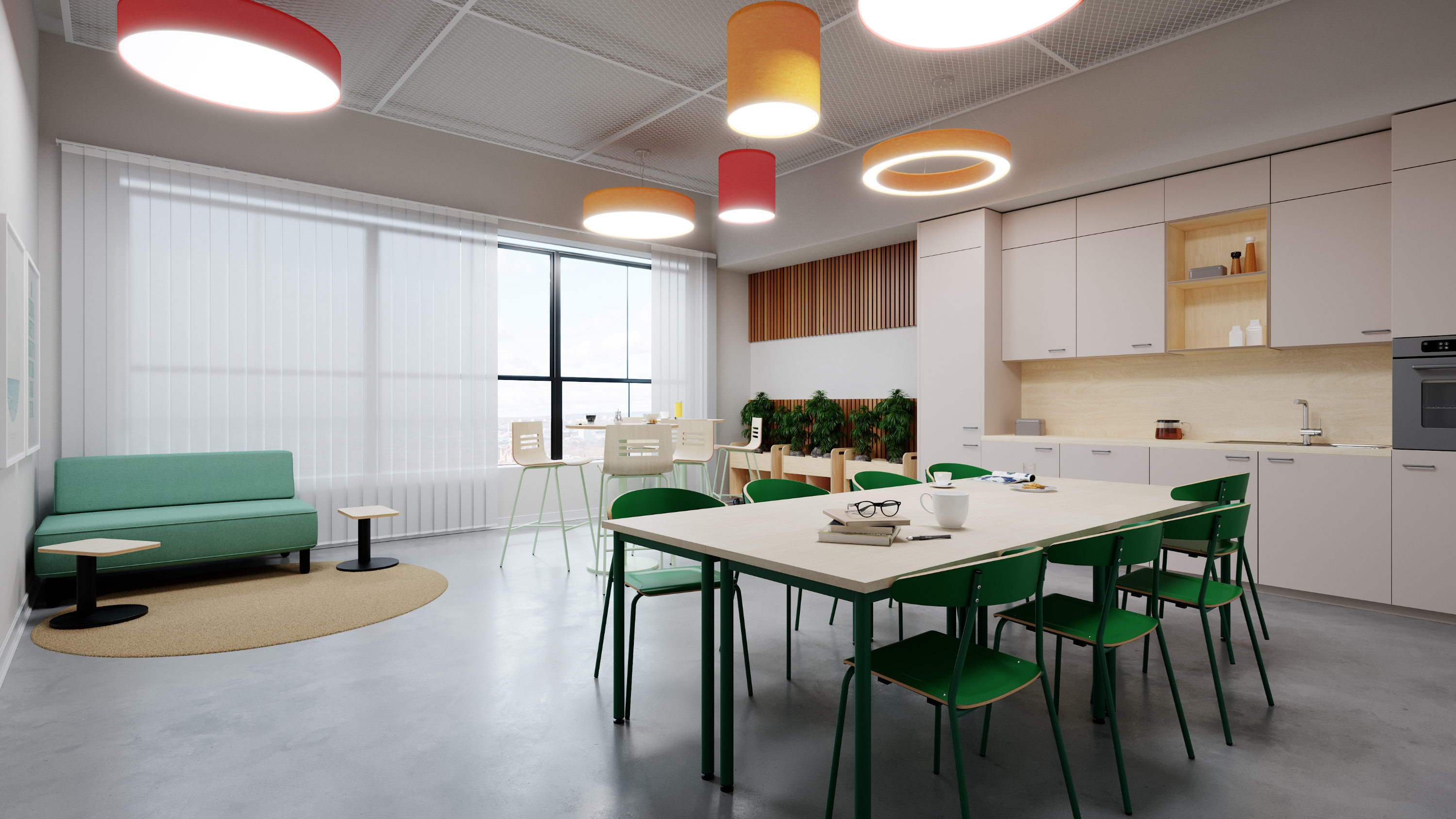 Ein Teamraum für Schulpersonal mit Tischgruppe, Sofa, Personalküche und Bistrotischen mit Barhockern.