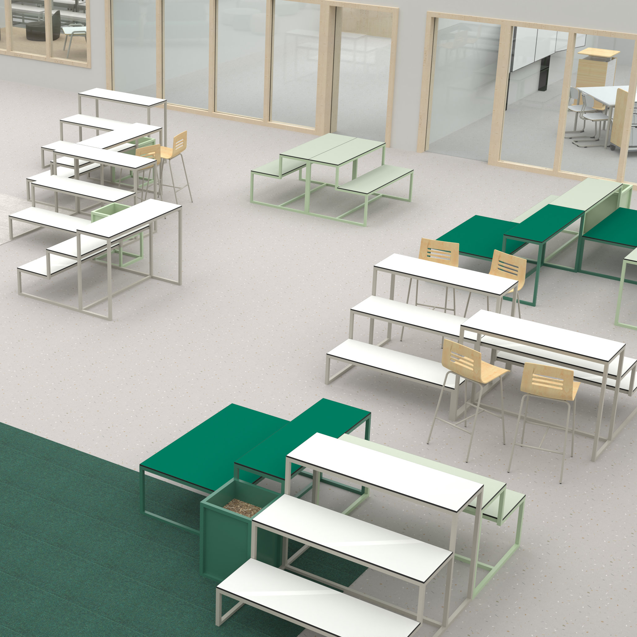 Offene Mitte einer weiterführenden Schule mit Sitztreppen in verschiedener Anordnung und Grüntönen.