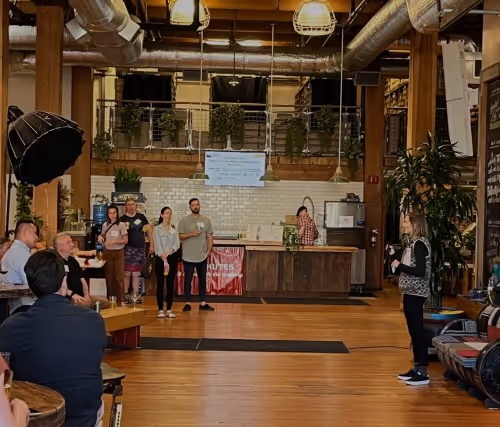 A group of people standing in a room.