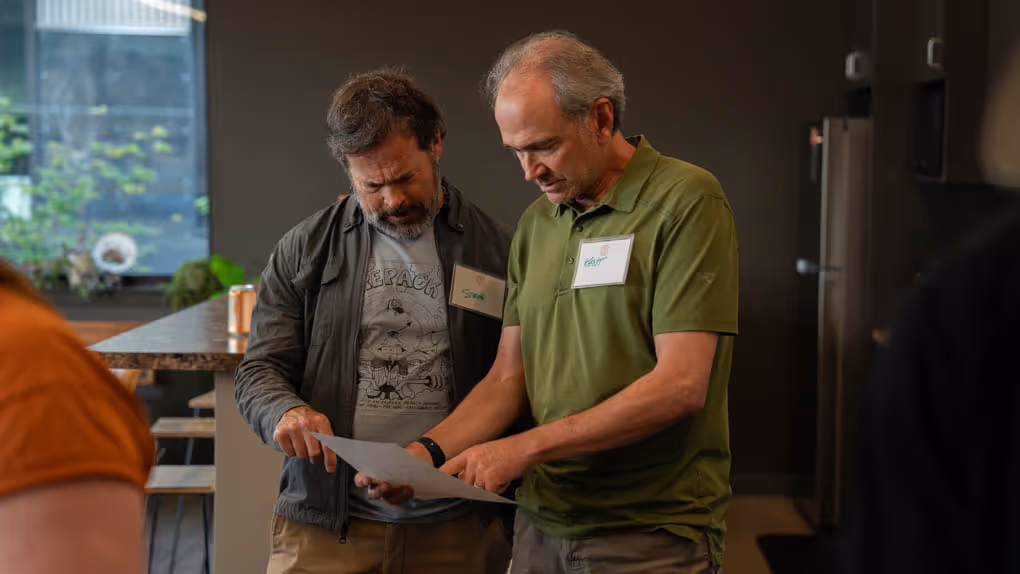 A couple of men standing next to each other.