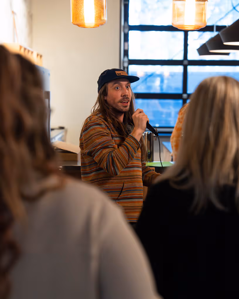 A man standing in front of a microphone.