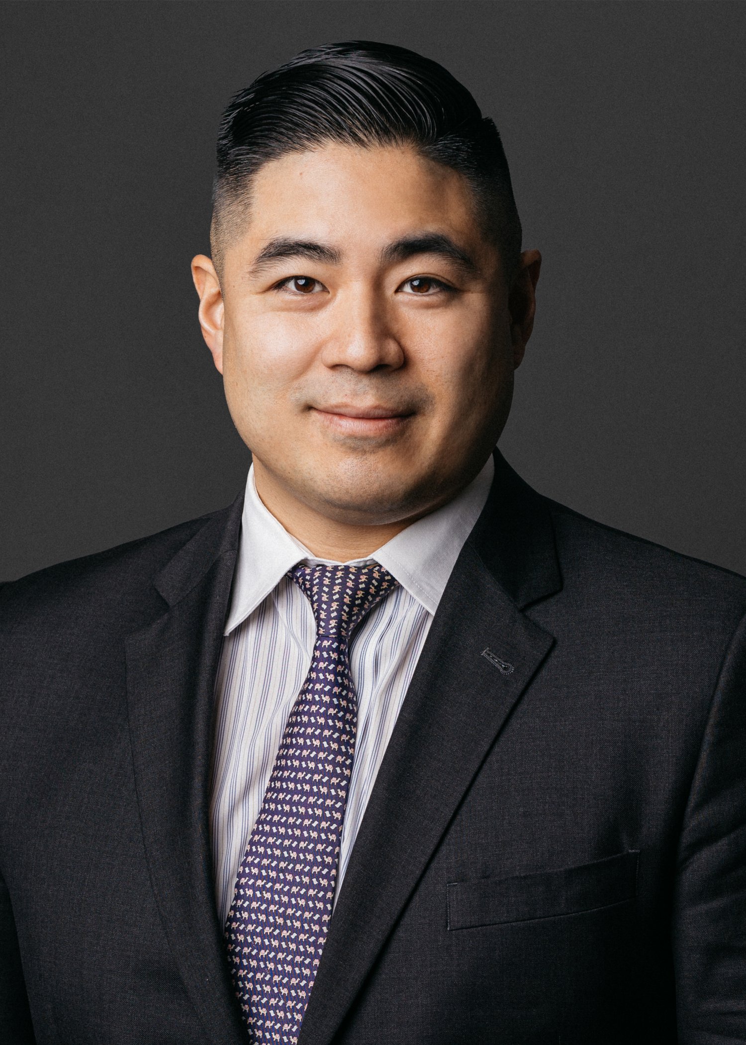 Headshot photo of Chris Okada