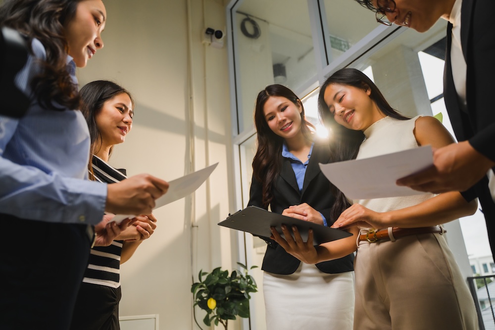 Communications professionals discussing healthcare marketing strategy