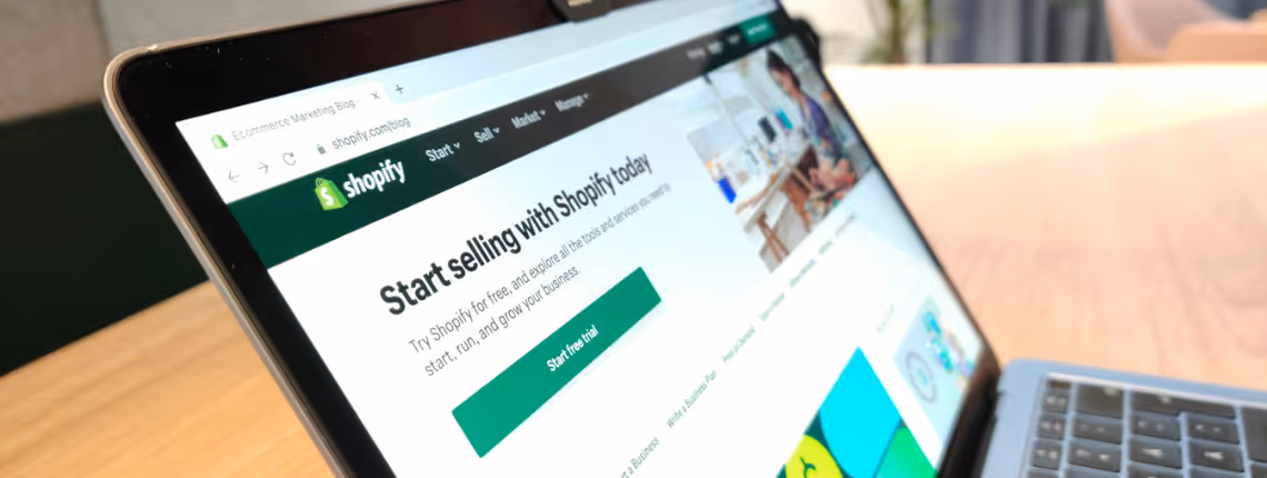 A Shopify store open on a laptop screen, symbolising a polished eCommerce front page without back-end systems.