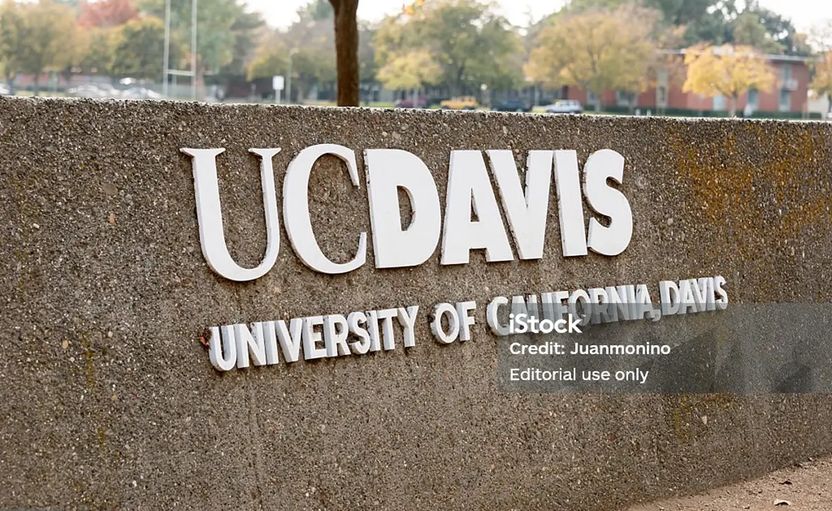 The university of california davis sign on the side of a building.