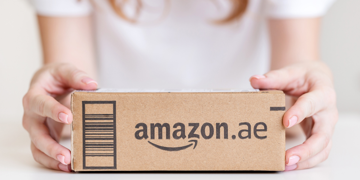 woman holding an amazon.ae box