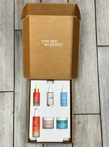 Open custom skincare box with branded insert and products
