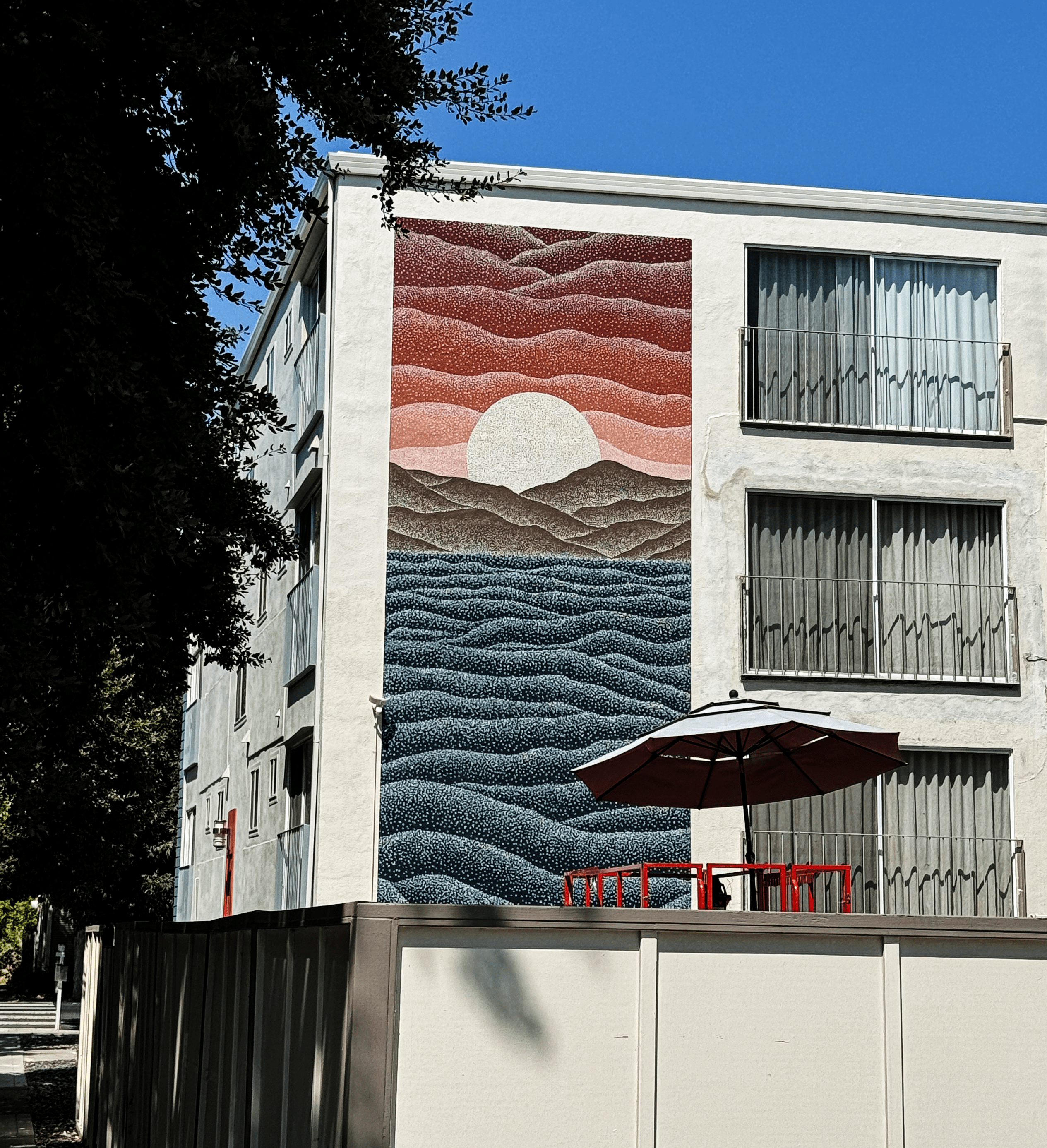 The 2400 Q Street exterior mural covering the side of a residential building in Sacramento, California