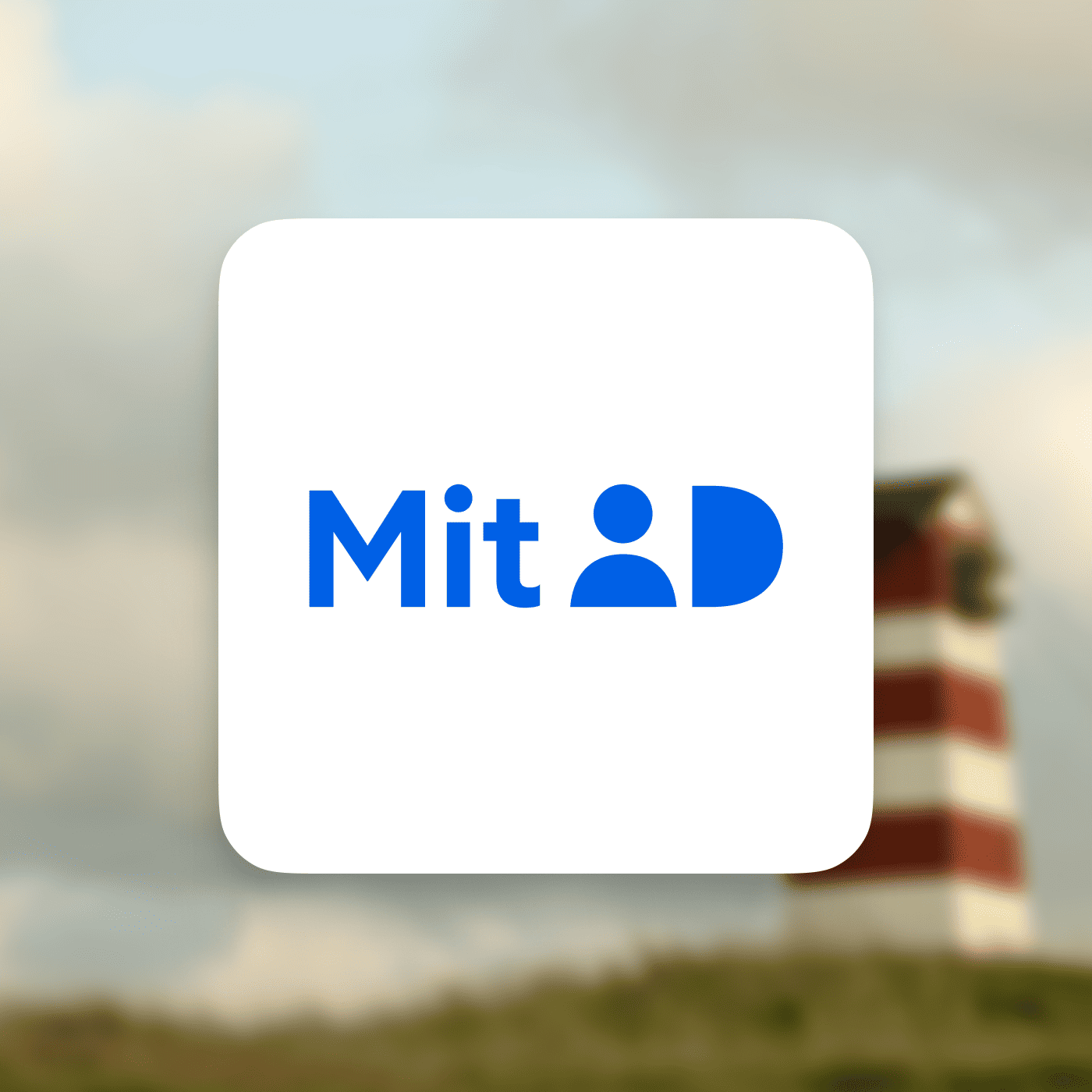 MitID logo på en sløret baggrund med et dansk strandtårn i rødt og hvidt.