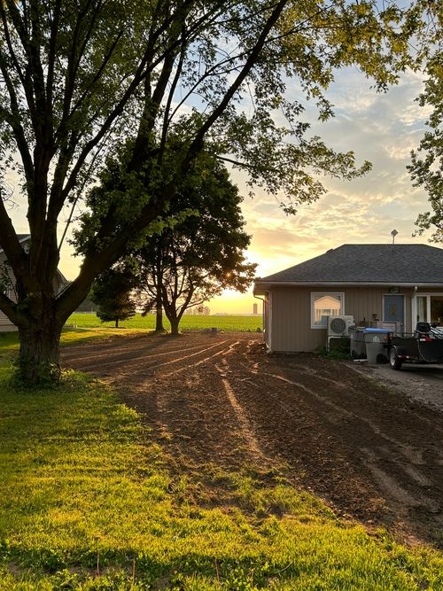 Sun rise and graded lawn.