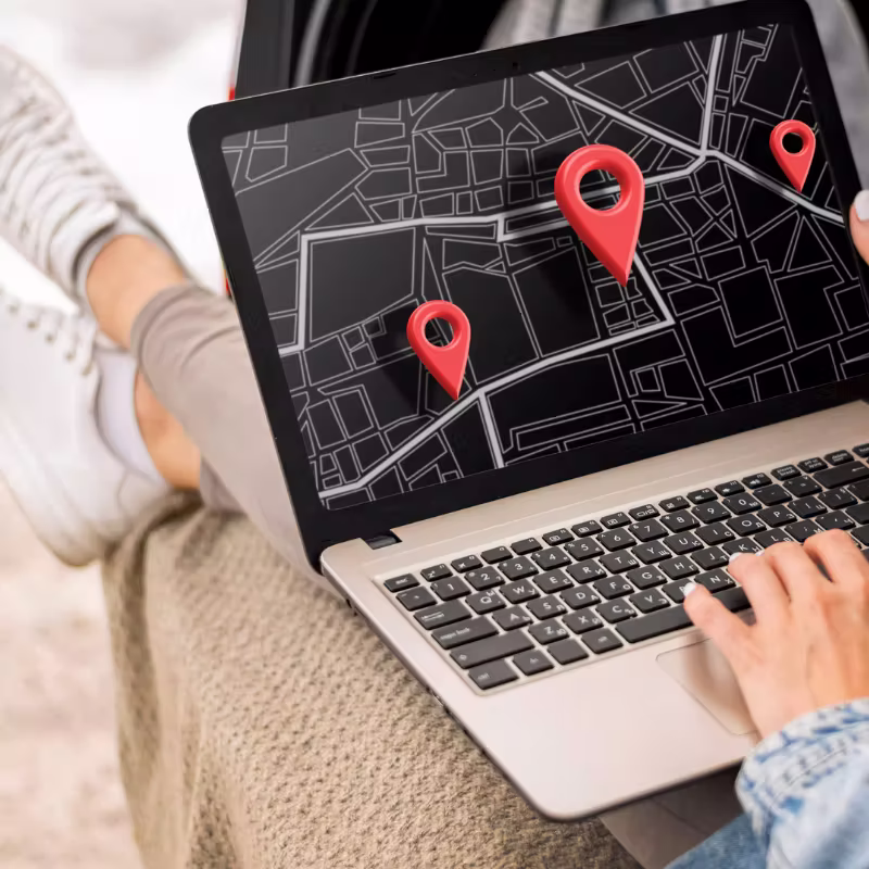 User showcasing a custom store locator map on laptop to boost SEO, enhance user experience, and increase conversions