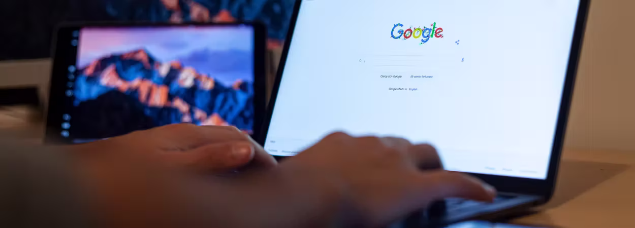 Man on laptop discovering local businesses with WordPress store finder plugin.