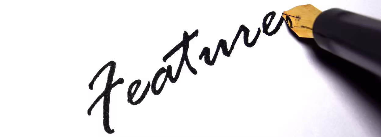 Visual metaphor of a pen and the word ‘Features’ — exploring important store locator capabilities.