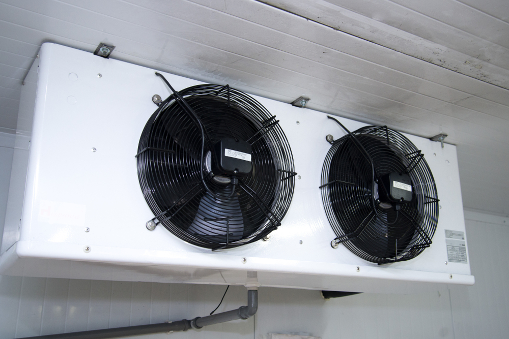 Refrigeration unit with dual fans for efficient cooling in a storage space.
