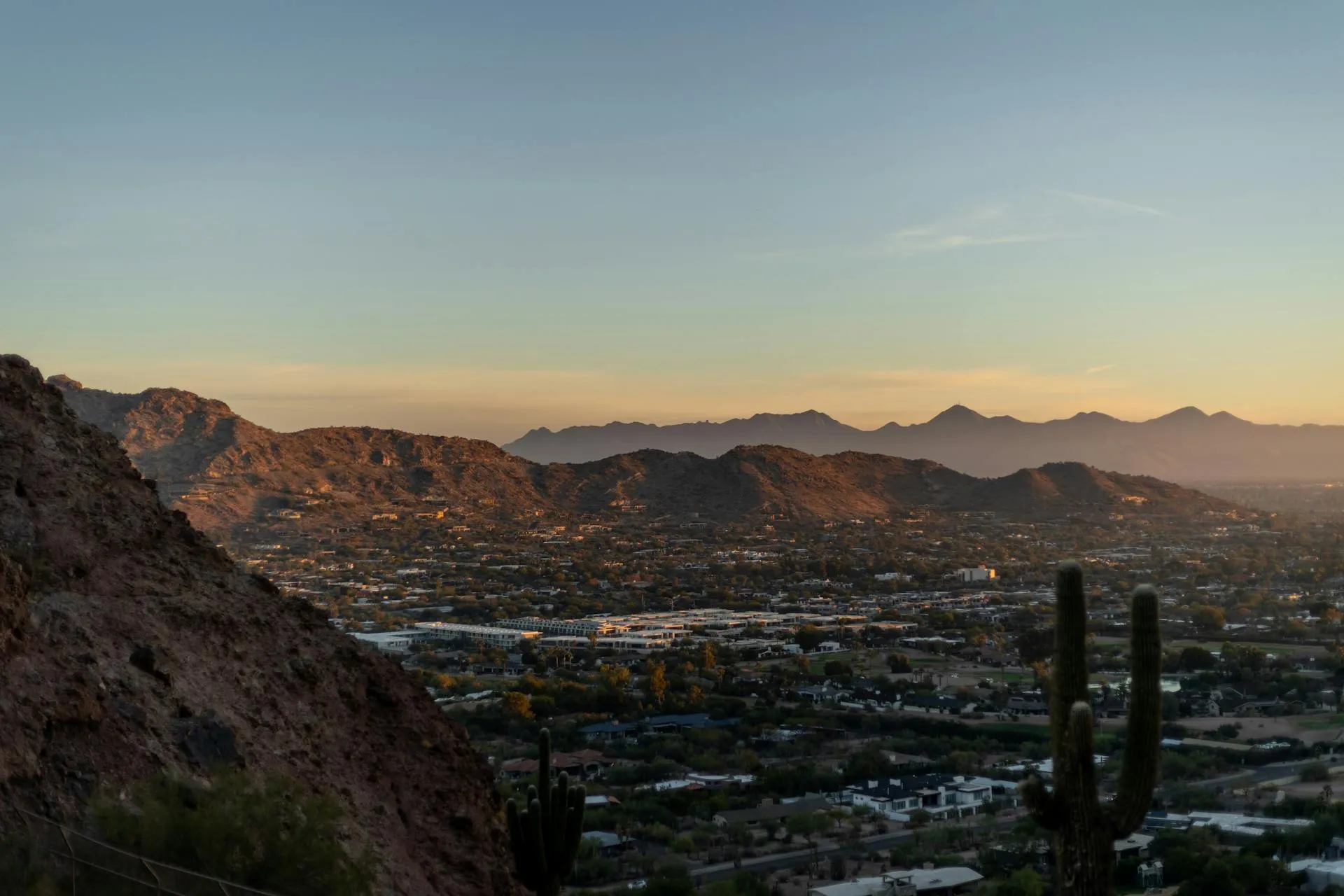 Sunset view of phoenix with mountains in the background.