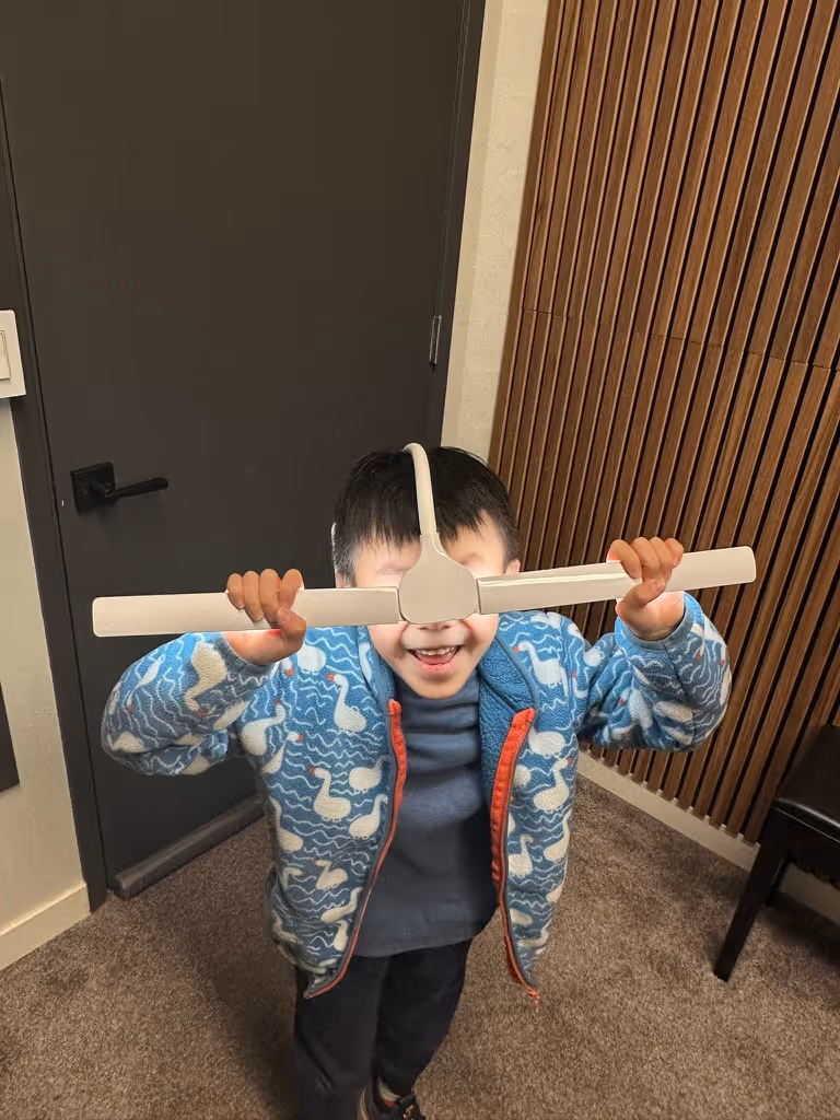 Little kid having a little fun after piano lesson at Pianoramic Studios Goofing off.