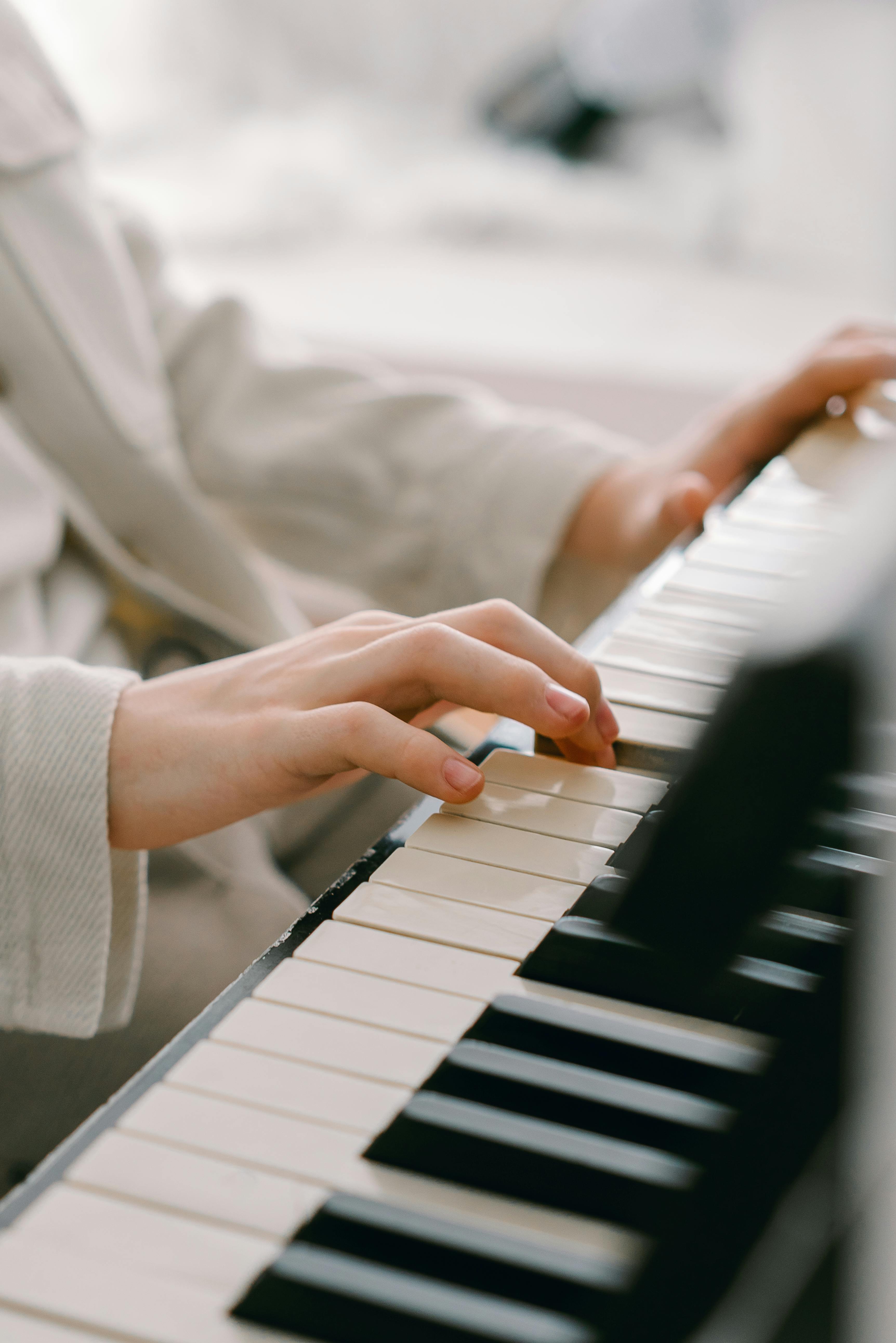 young kid playing piano at home