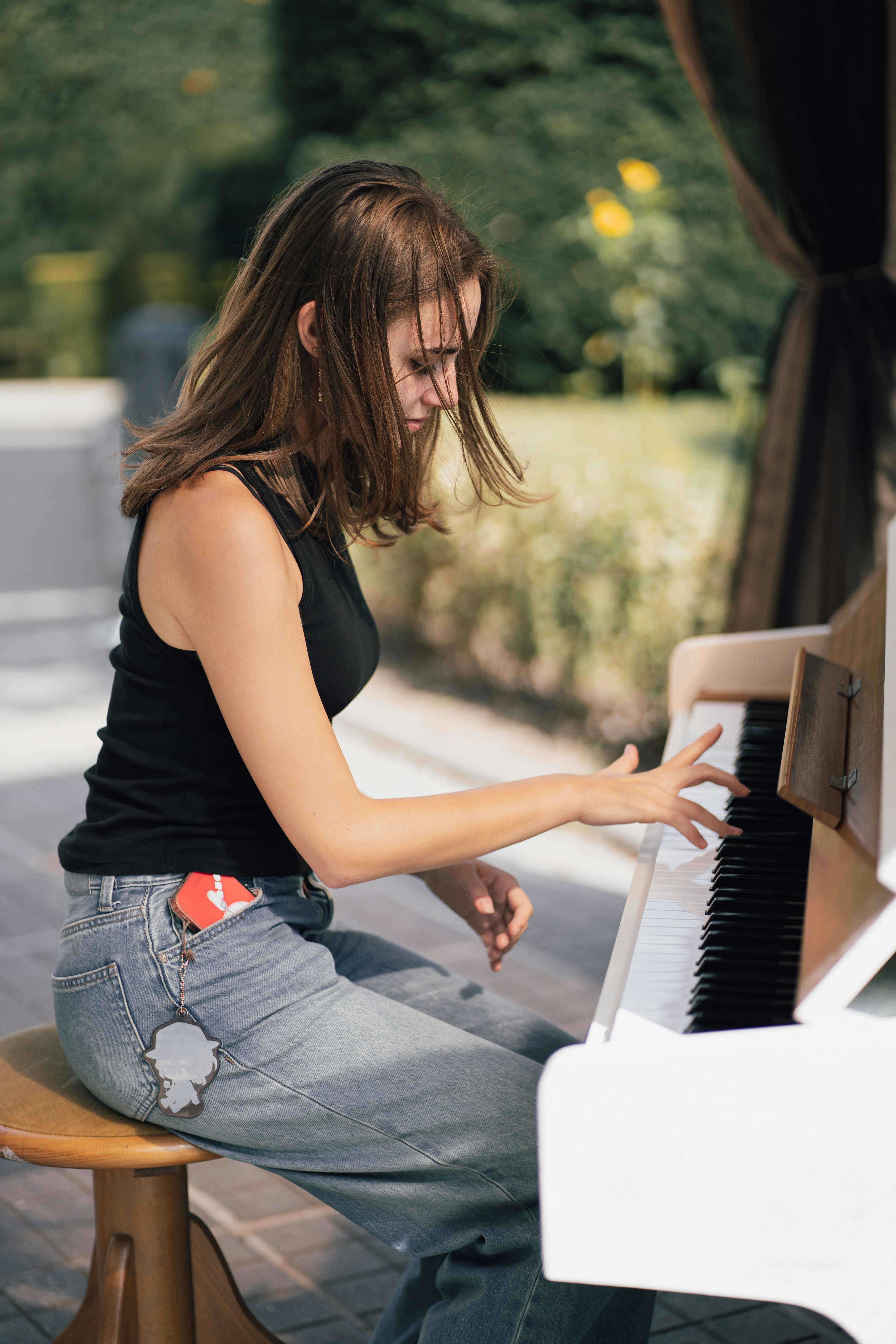 adult playing piano in nature