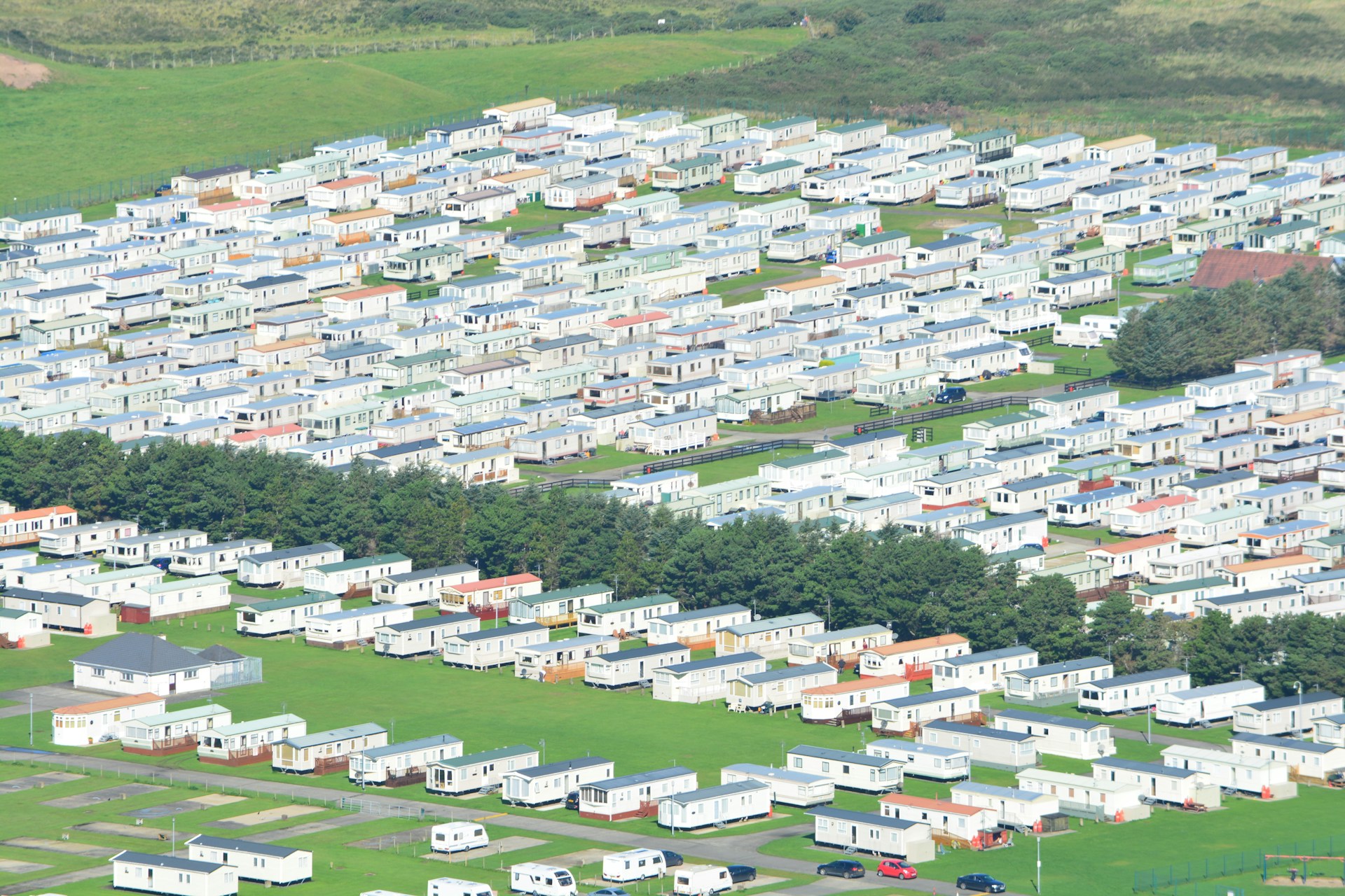 Aerial view of densely packed mobile homes and trailers in a large campground