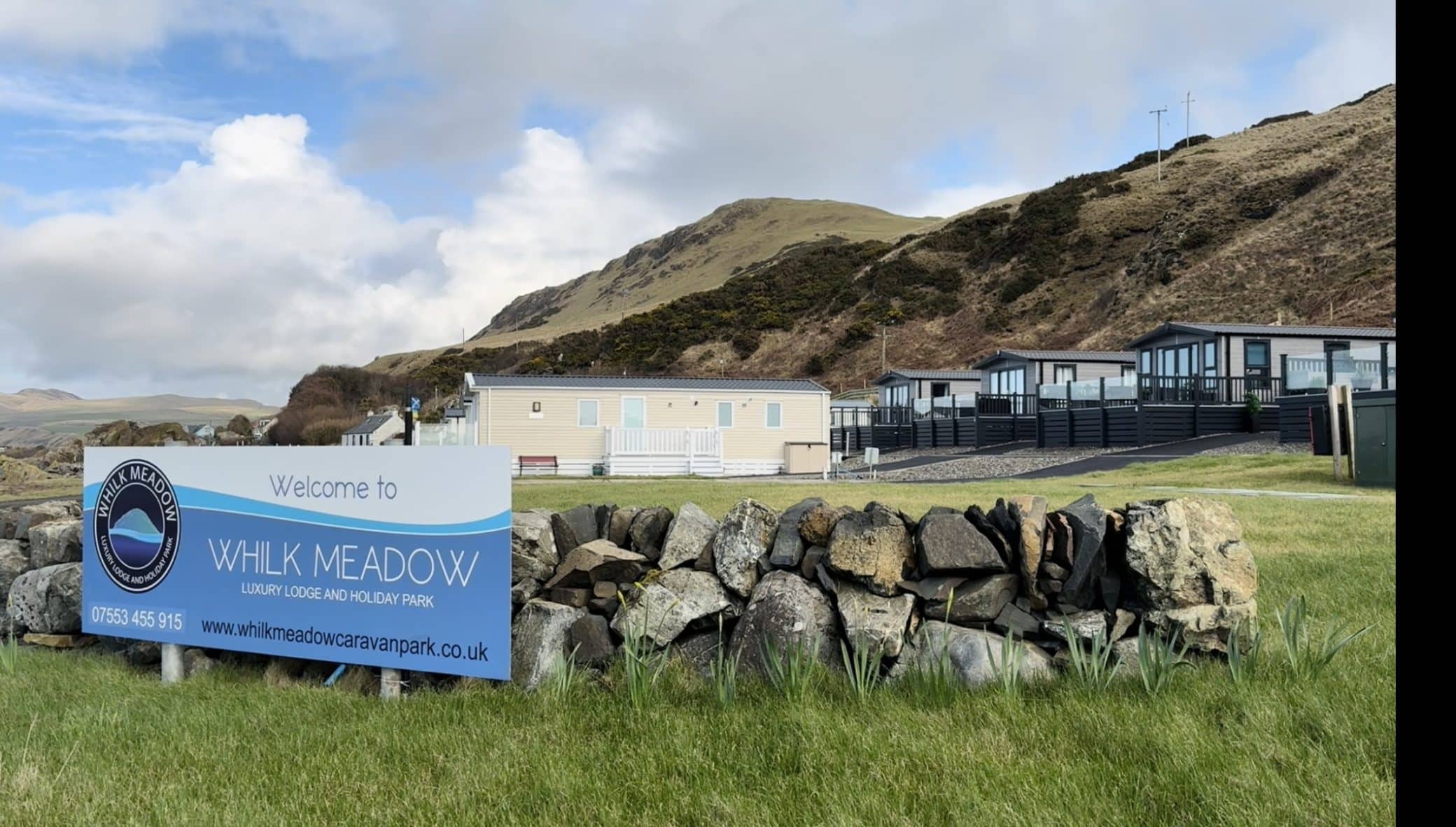 Whilk Meadow Luxury Lodge and Holiday Park with mountain backdrop