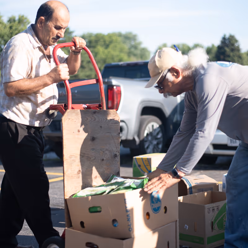 men unloading boxes