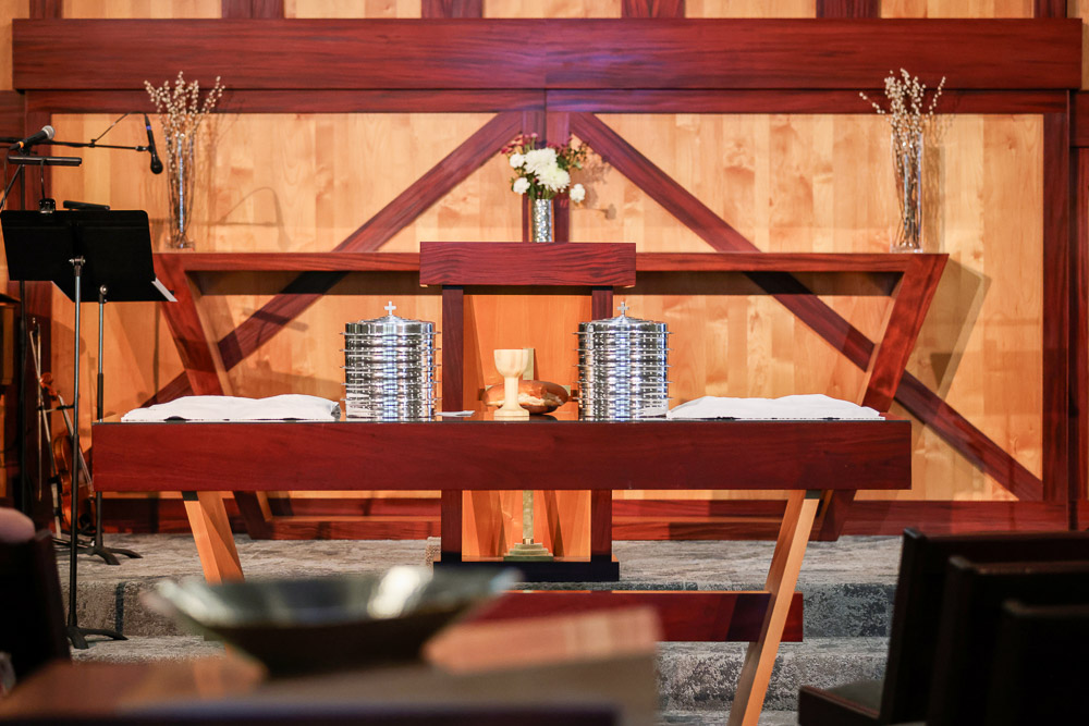 Communion table at the front of a church sanctuary