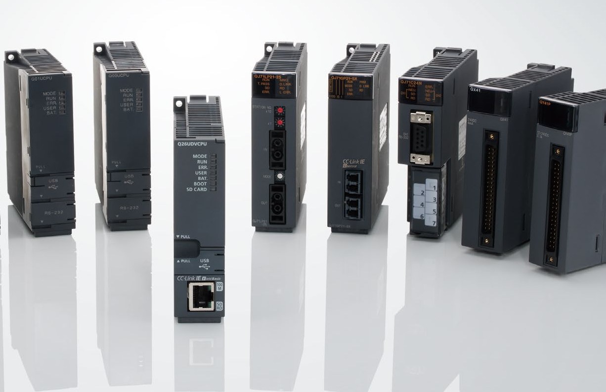 Lineup of Mitsubishi Electric MELSEC-Q series PLC modules: CPU modules including Q26UDVCPU, network and serial communication modules, and QX41 input and QY41P output modules