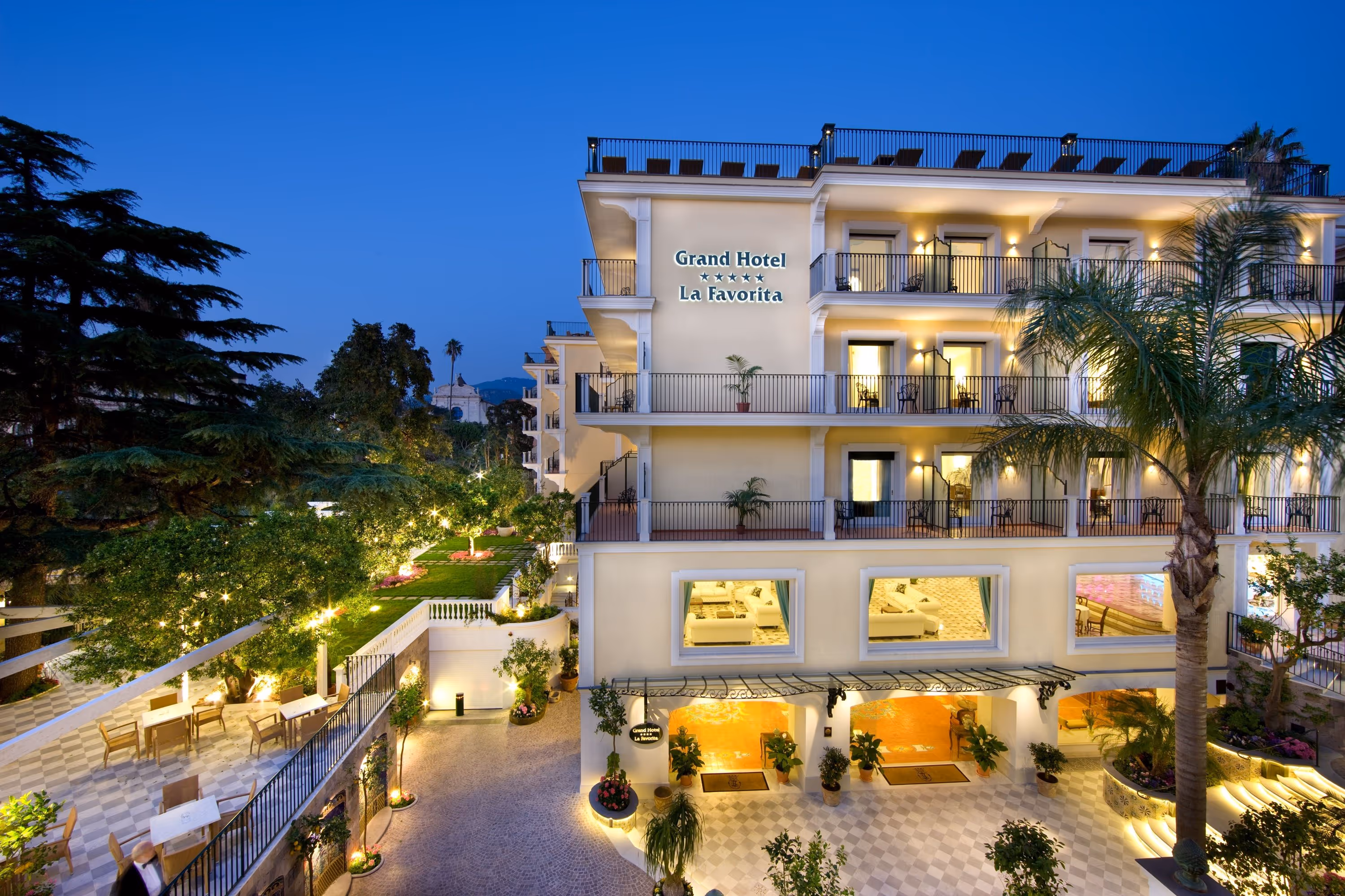 A building with a lot of windows and lights on it.