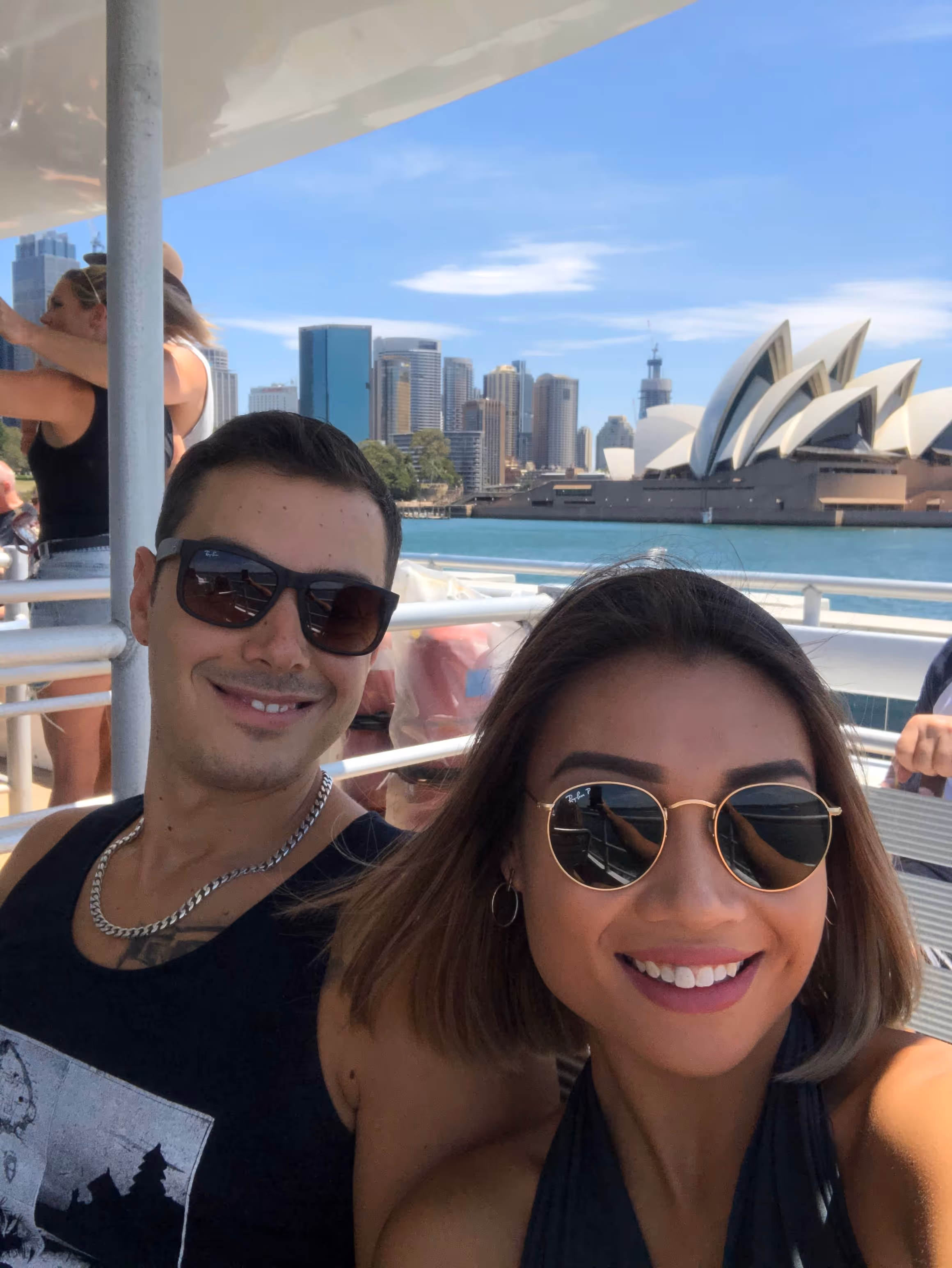 A man and a woman sitting on a boat.