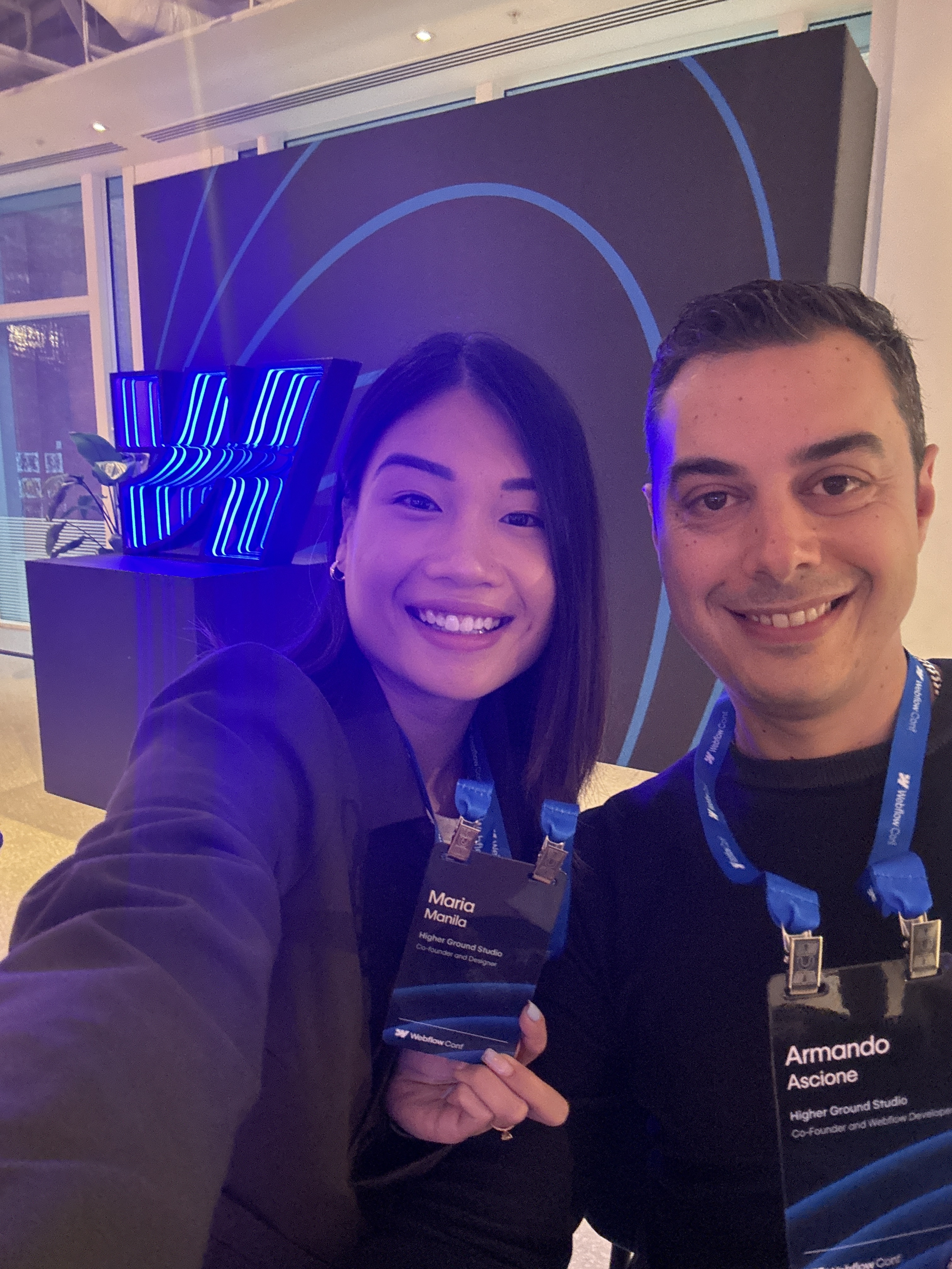 A man and a woman wearing face masks at an airport.