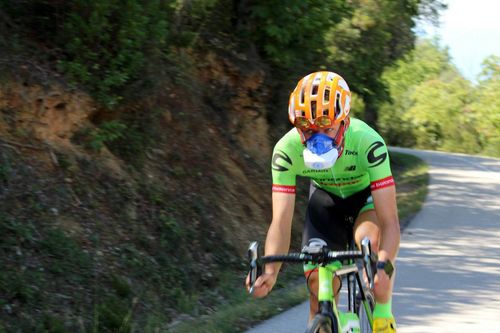 A photo of a person on bicycle with VO2max mask