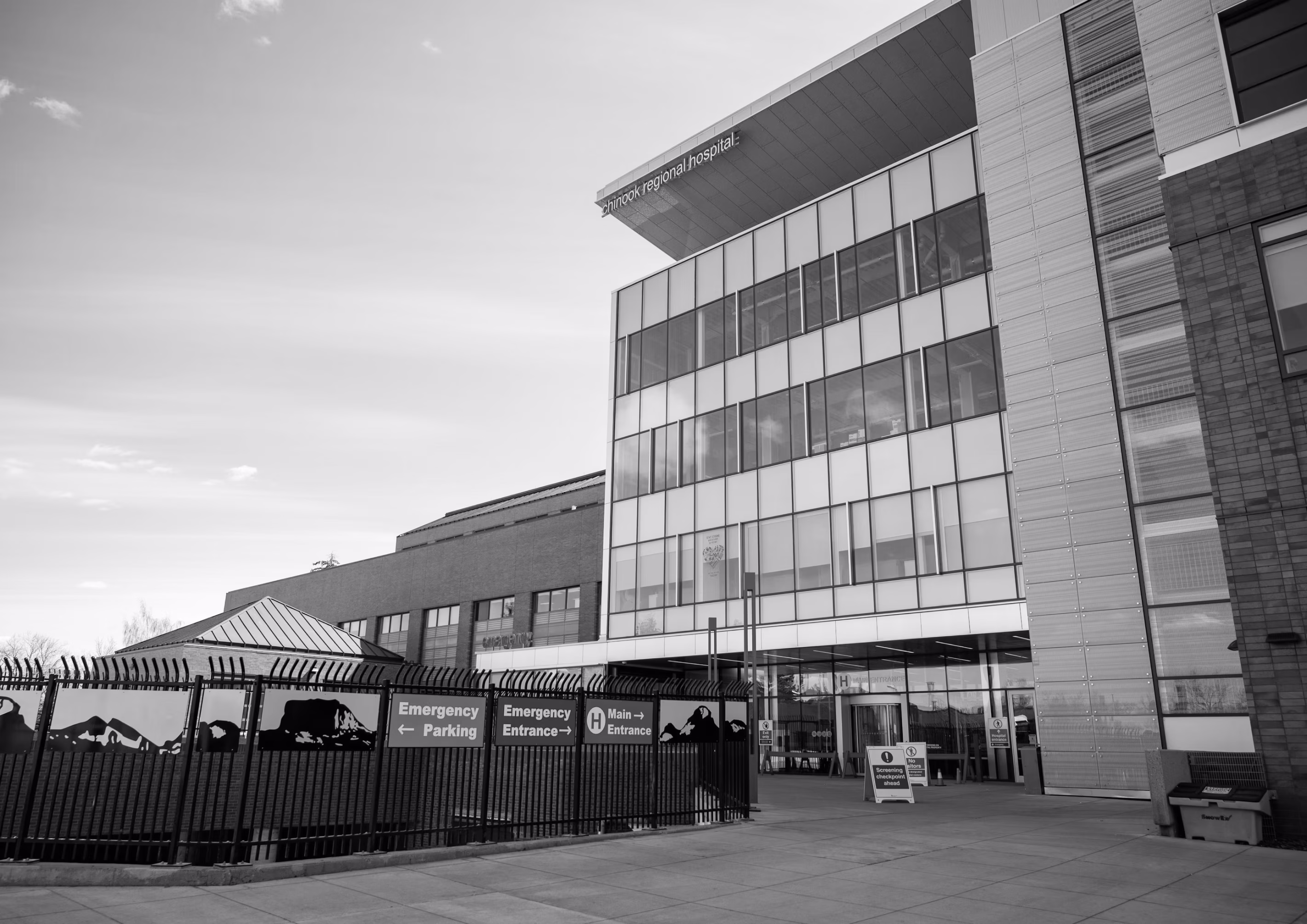 Exterior of a hospital and its emergency department entrance.
