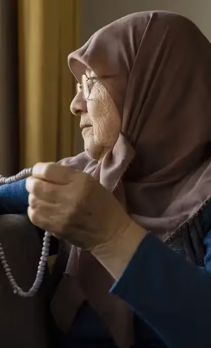 Muslim senior couple looking worried while exploring assisted living options.