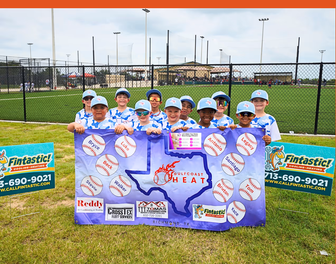 Youth baseball team Gulf Coast Heat posing with team banner