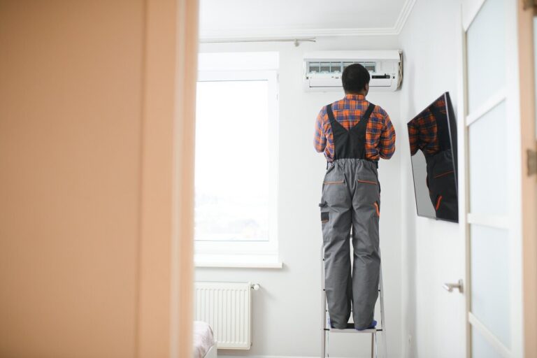 Man working on HVAC unit